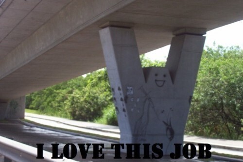 meme of a smiling face painted onto a support of a bridge with the text "I love this job"